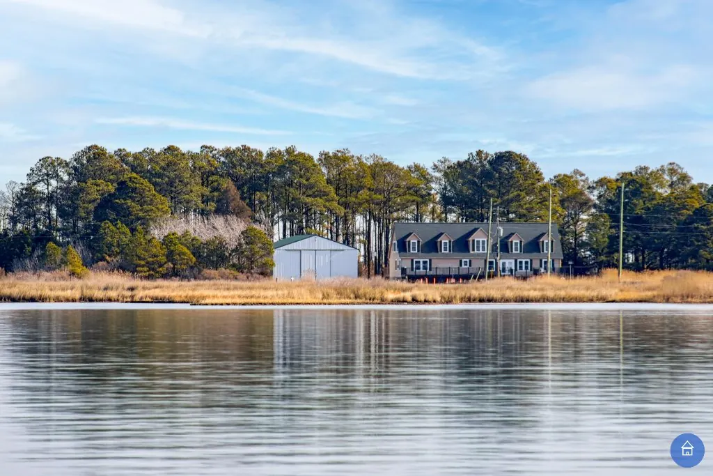 Multigenerational family on the sunny rear deck with bay marsh views