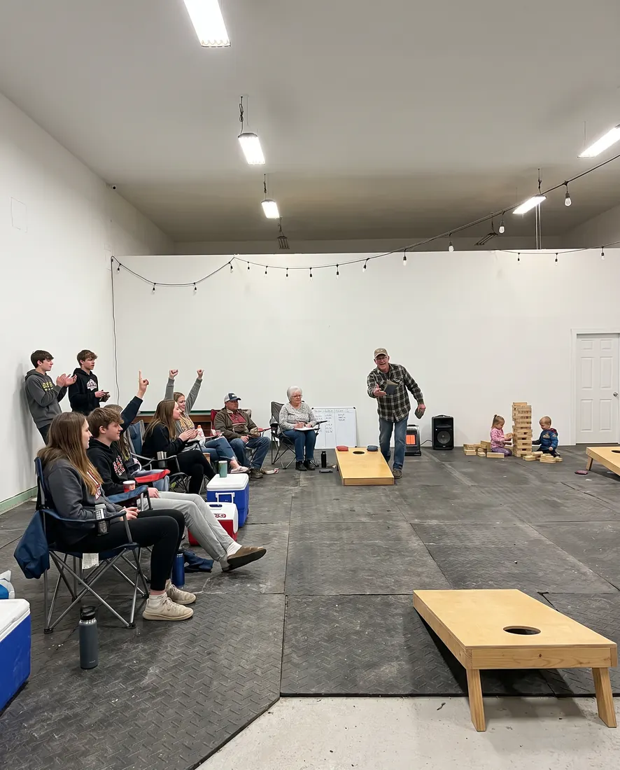 Family playing games in the Flex Barn on a rainy afternoon