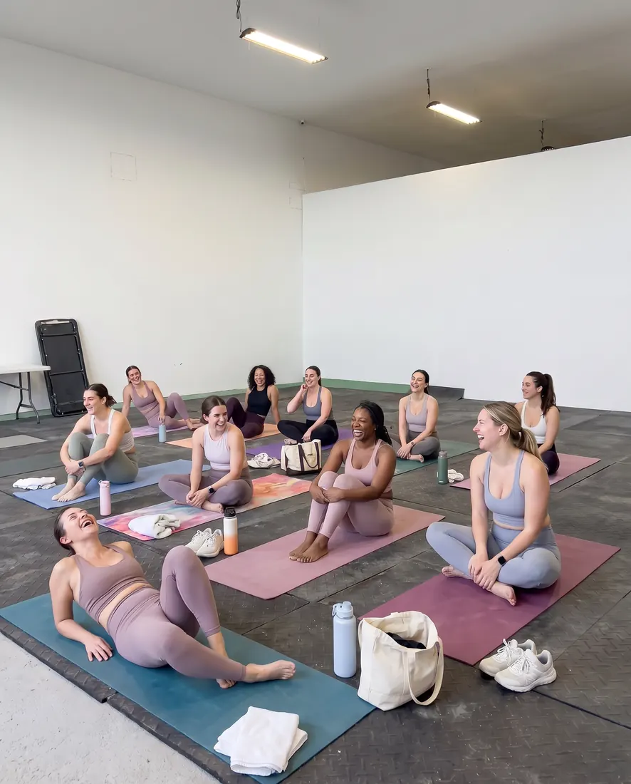 Yoga class in the Flex Barn with natural light and open doors