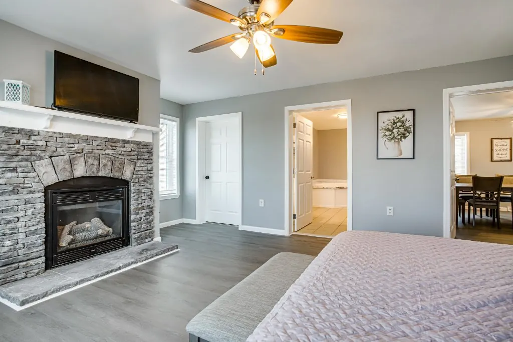 The main-level master bedroom at The Bayside Escape, with a king bed