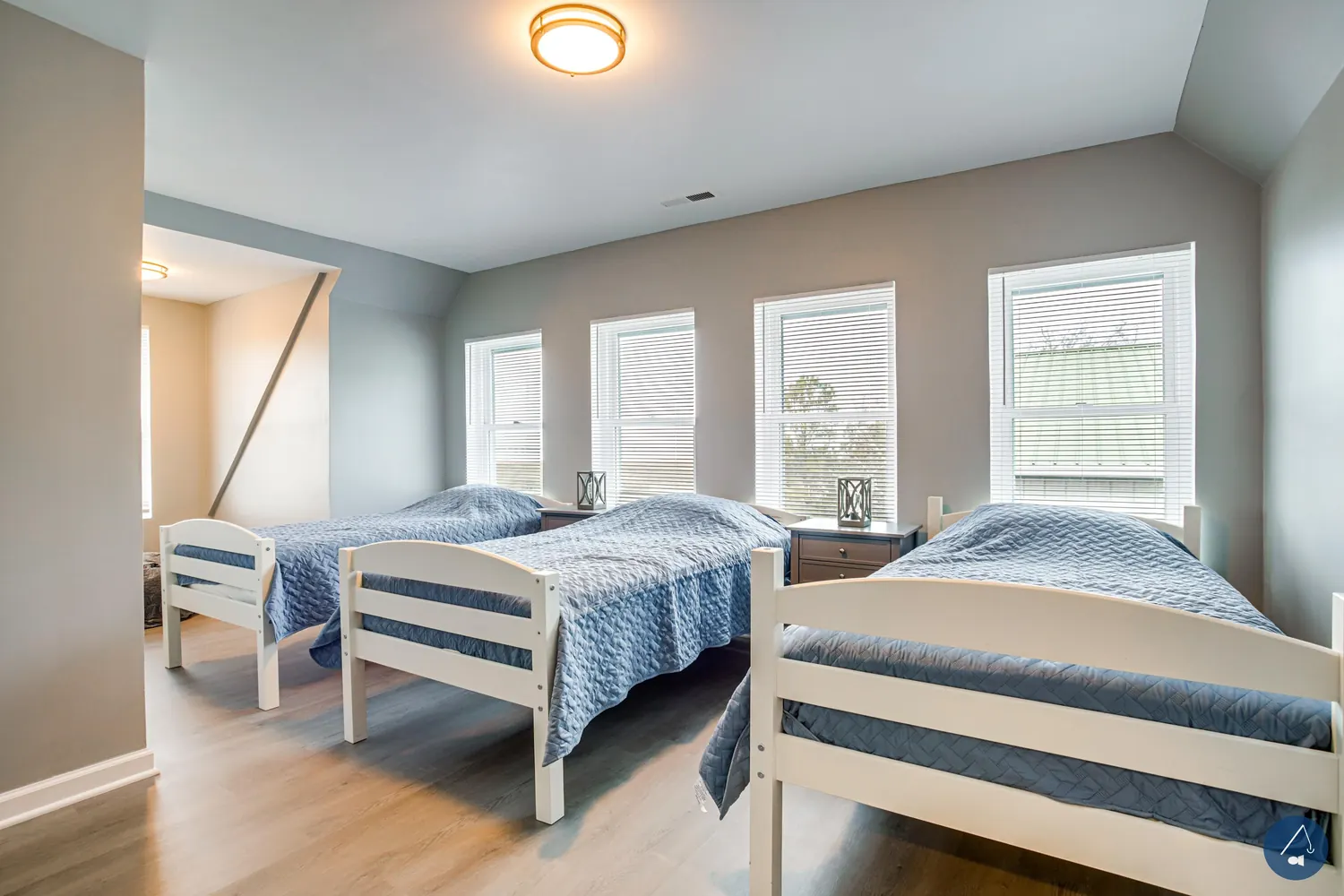 The bunk room, four twins for a crew splitting the cost